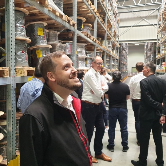 Allan Mason-Whelan photographed in awe looking at the HELUKABEL warehouse cable stock.